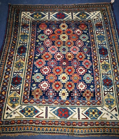 A Caucasian Kuba blue ground rug 142 x 127cm